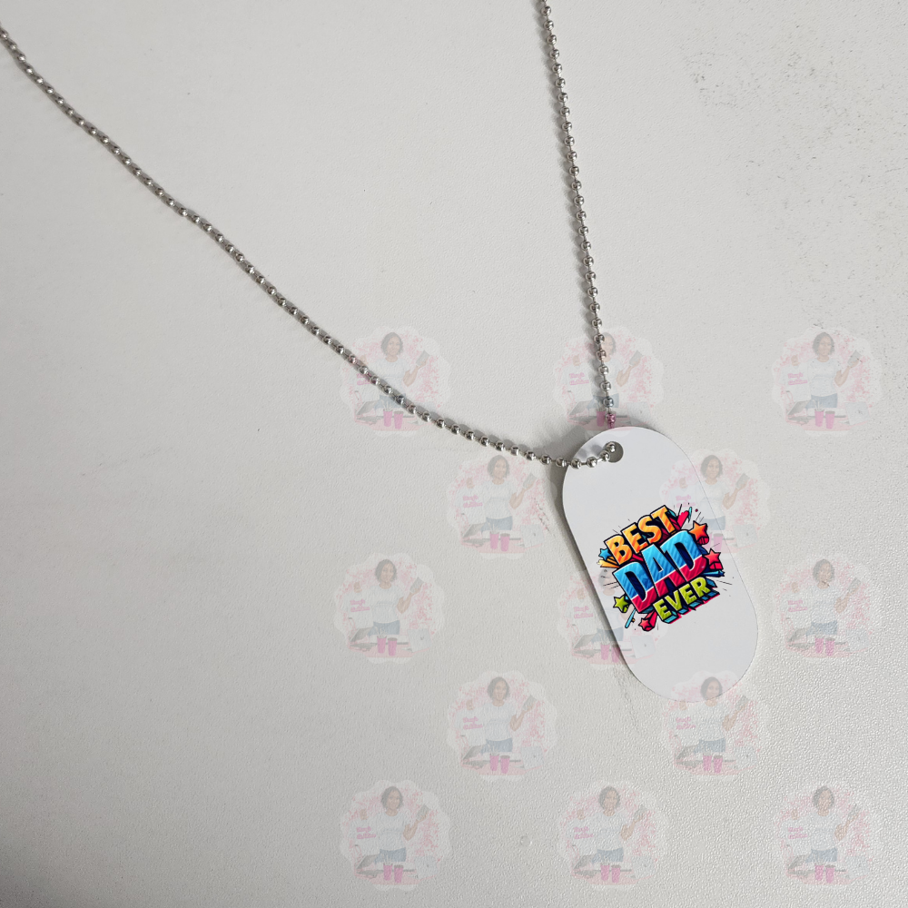 Dog tag with 'Best Dad Ever' text on a chain against a light background